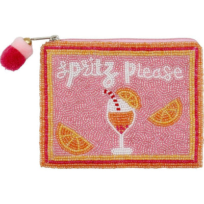 The Spritz Please Beaded Coin Purse by Judson & Company is a rectangular cotton pouch with Spritz Please” in white beads, featuring a beaded drink with straw and orange slice, pink base, orange and yellow borders, and a red and white pom-pom on the zipper.