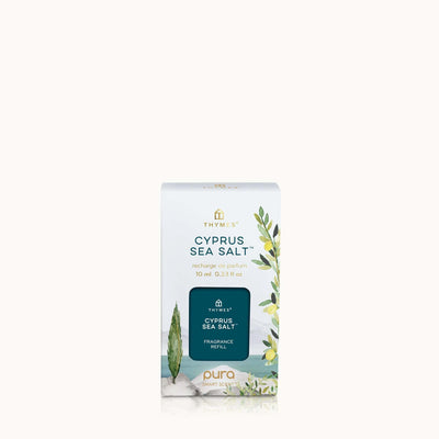 The Thymes Cyprus Sea Salt Pura Diffuser Refill, 10 ml (0.33 fl oz), features a design with green leaves and a seaside illustration with the Thymes logo, ideal for enhancing your smart home diffuser experience.