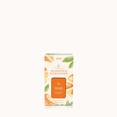 The Mandarin Coriander Pura Diffuser Refill by Thymes is designed for the Pura Smart Home Diffuser and comes in a box adorned with illustrations of mandarin slices and coriander leaves on a light background.