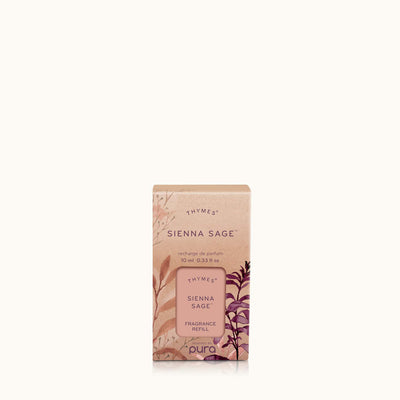 A Sienna Sage Pura Diffuser Refill by Thymes against a light beige background, featuring packaging with earthy floral and leaf designs. Ideal for your Pura Smart Home Diffuser, it brings natural essences to your space.