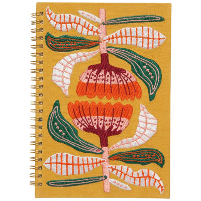 Embroidered notebook with floral design on a yellow background
