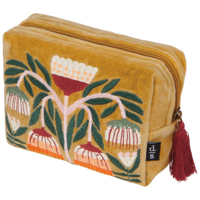 Yellow pouch with floral design and tassel on a white background