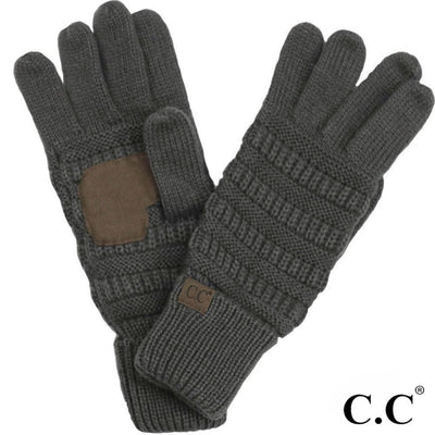 Judson & Company’s CC Lined Women's Gloves feature thick, dark gray knit with ribbed patterns, a suede index patch, and a small CC logo tag at the wrist. Pair them with a cozy acrylic beanie for added style.